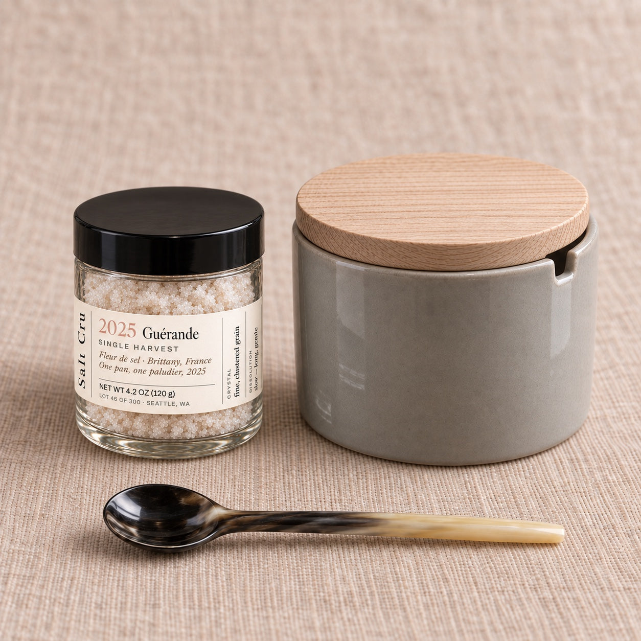 Single Harvest fleur de sel with a gray porcelain pot, wood lid and horn spoon